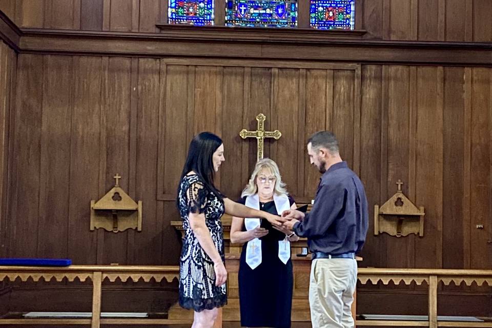 Marriage ceremony in a chapel.