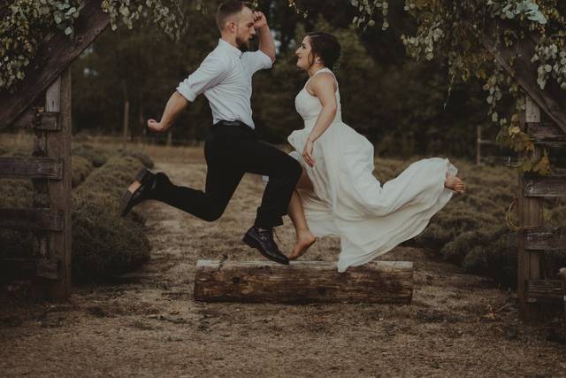Jump shot of newlyweds