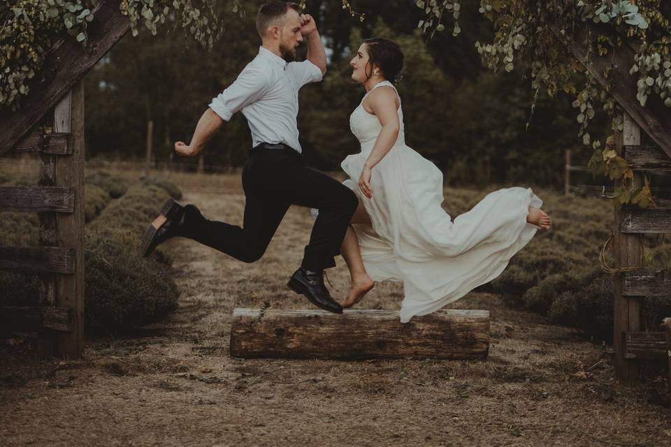 Jump shot of newlyweds