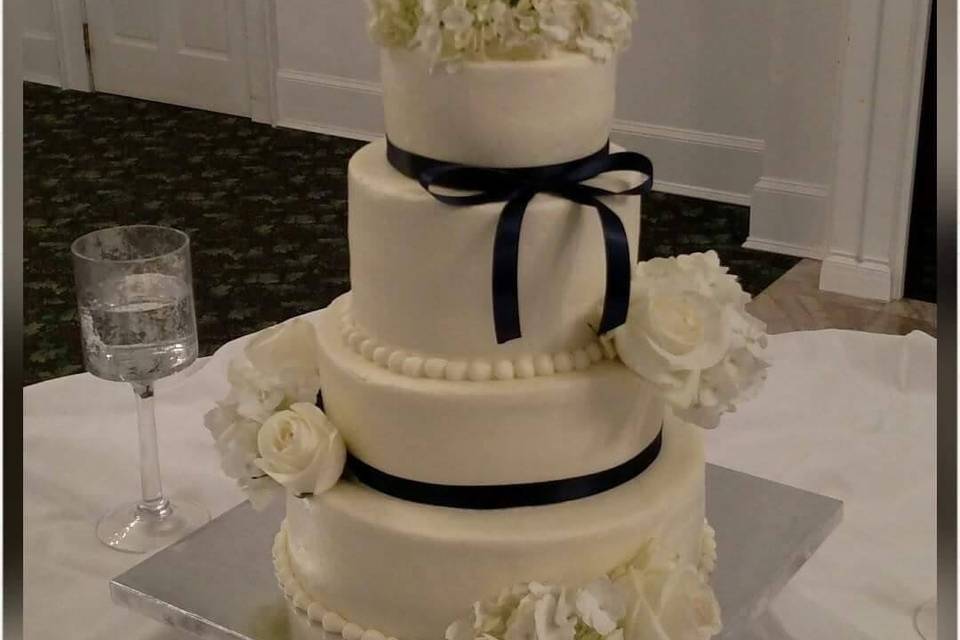 White cake with black ribbon