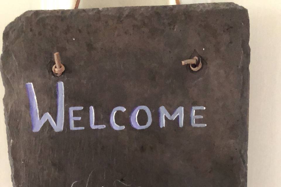 Hand painted slate welcome sign ( has not been personalized in this photo)