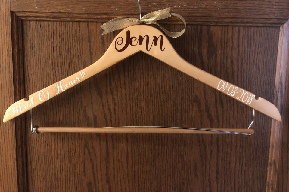 Personalized maid of honor dress hanger.