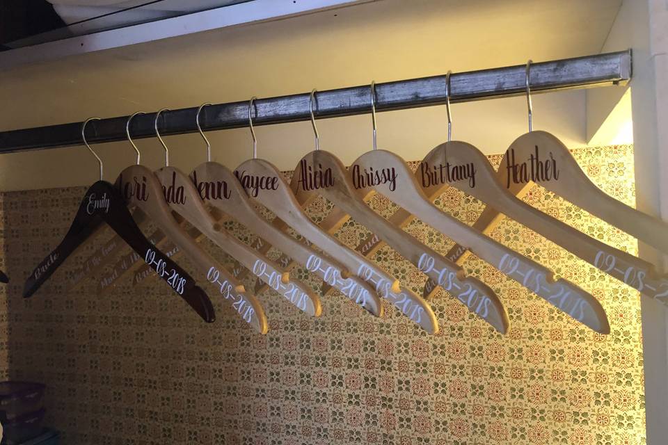 Personalized wedding party hangers.