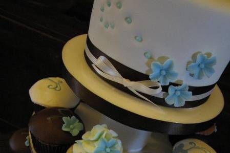 Blue and brown cupcake tower with 6 inch top cutting cake