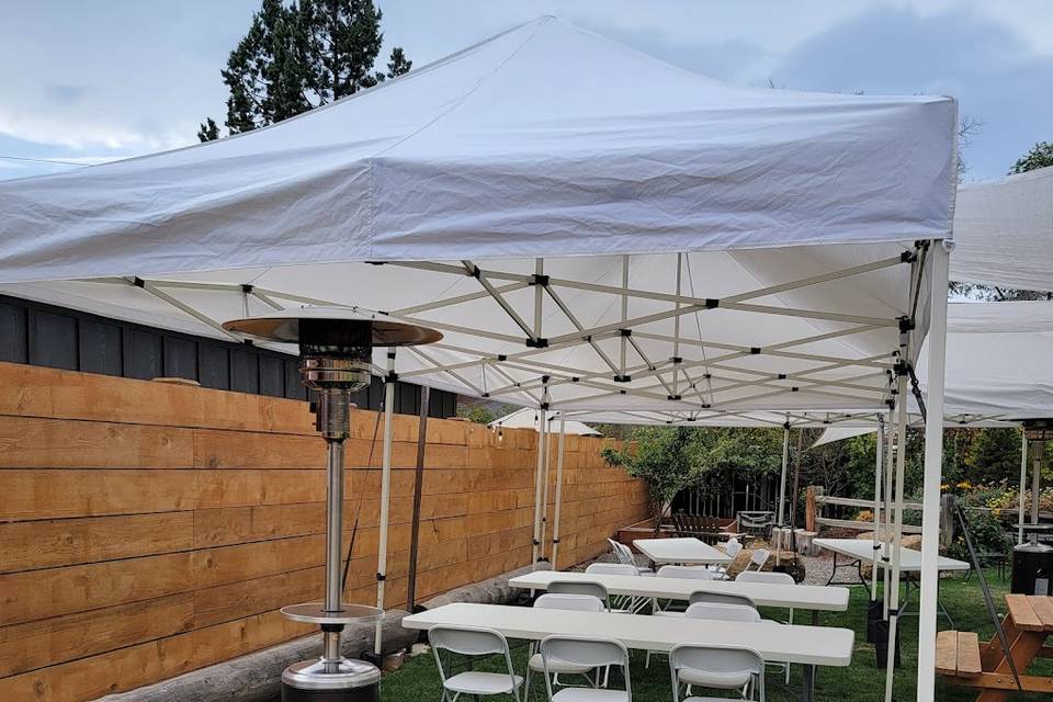 Heaters, tent, and tables
