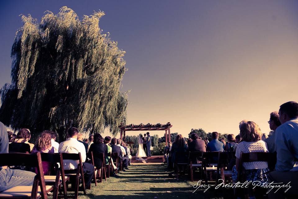 Pergola ceremony at sunset