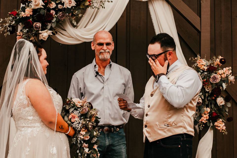 Groom tearing up during vows