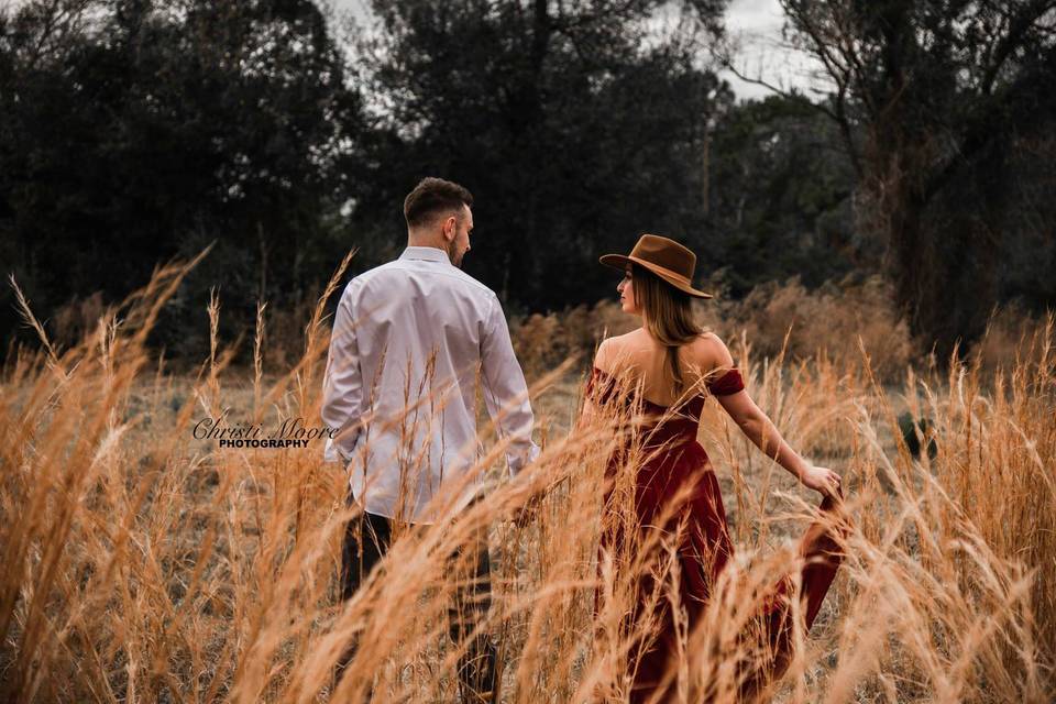 Couple walking through the field