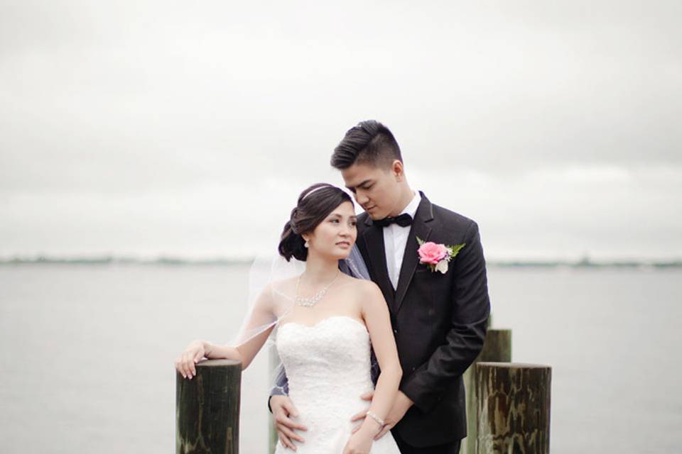 Bride and groom on dock