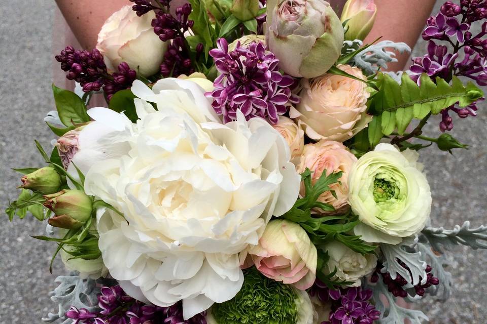 Maid of Honor Bouquet made with white peony, garden roses, anemone, lilac and ranunculus