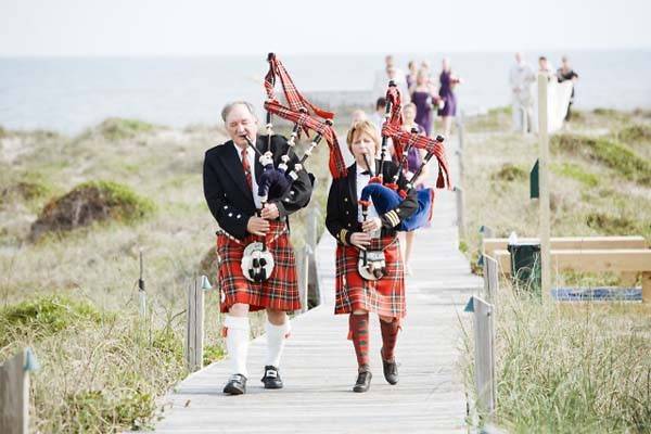 Bagpipes leading the wedding party to the wedding!