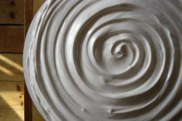 Red velvet cake with vanilla meringue frosting.