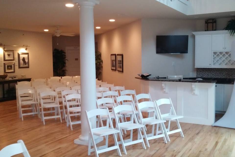 Indoor ceremony with our gear covers blending the speaker and stand right into the back drop. This is an included feature with all ceremony packages.