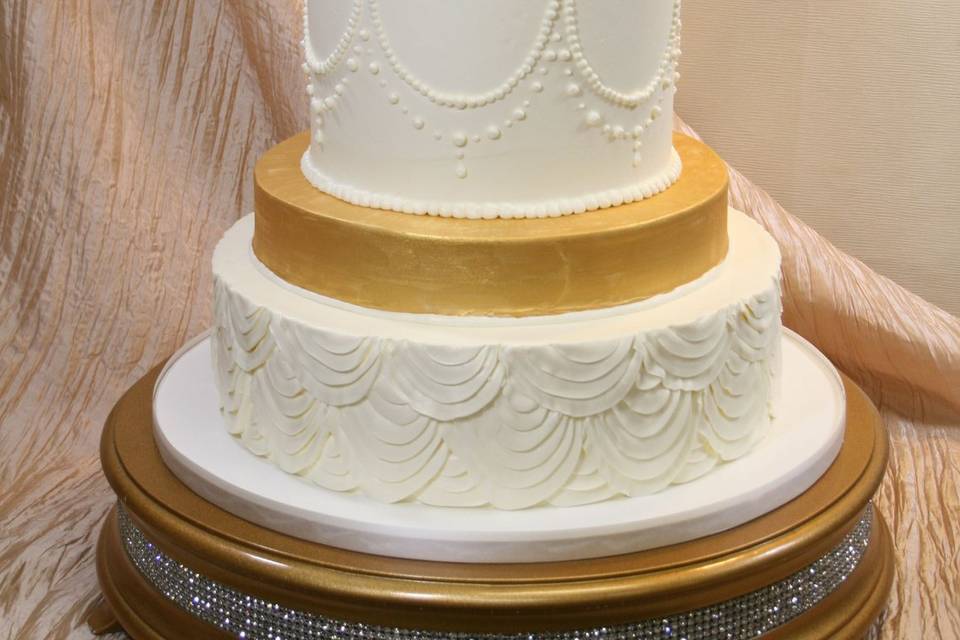 Wedding cake with gold tier