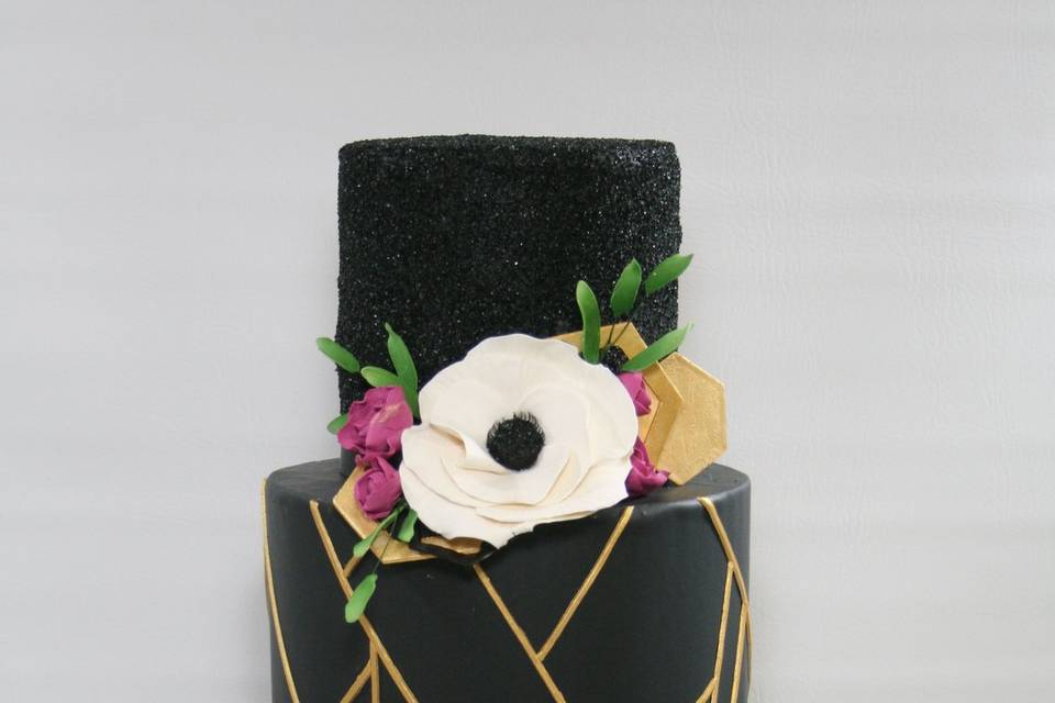 Black wedding cake with gold details