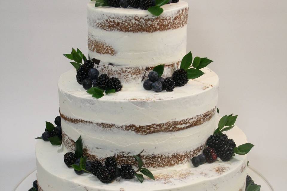 Naked wedding cake with berries