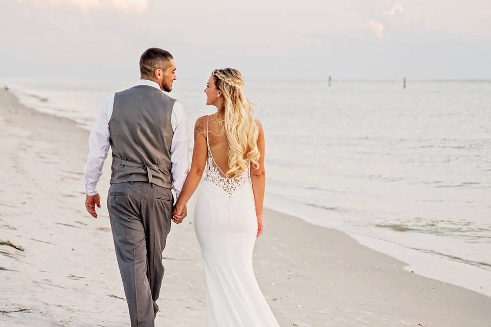 Bride and groom on beach