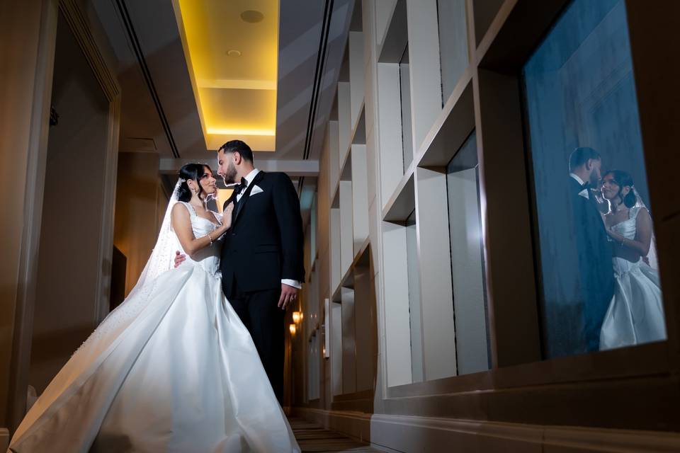 White gown in a lit hallway