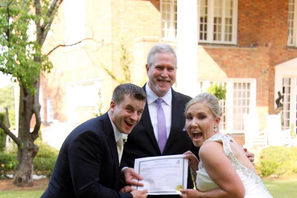 Couple with the officiant