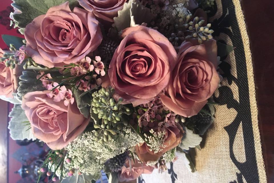 Amnesia Roses, White Ranunculus, lavender wax flower, queen anne’s lace, seeded eucalyptus, blue thistileand dusty miller