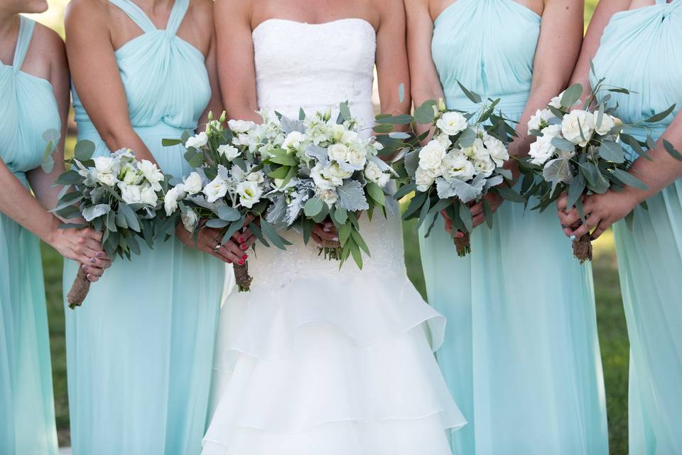 Minty Frost Florals featuring Dusty Miller, Mint Delphinium, White Spray Roses, White Freesia, White Lisianthus, Silver Dollar & Willow Eucalyptus Photo Credits: Marissa Eileen Photography