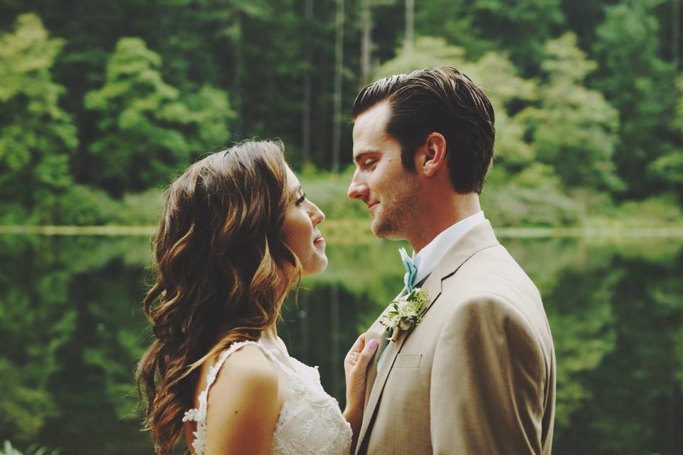 Couple kissing beside a lake