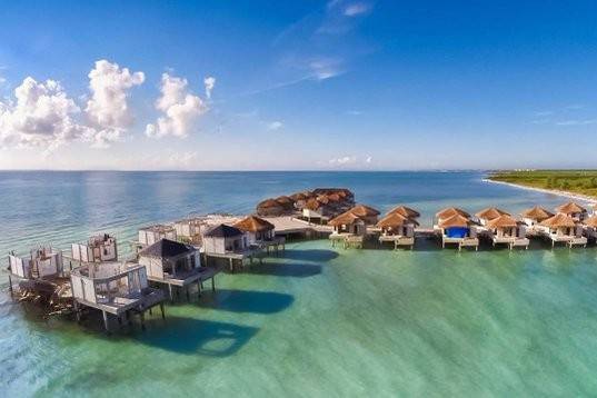 These elegant Overwater Bungalows offer breathtaking ocean views and unparalleled luxurious accommodations. Every Bungalow offers extraordinary views of spectacular sunrises and stunning sunsets uniquely situated just off the sugary white sands of Maroma Beach - Voted by Travel Channel as one of the top 10 beaches in the world. Available Sept. 1, 2016