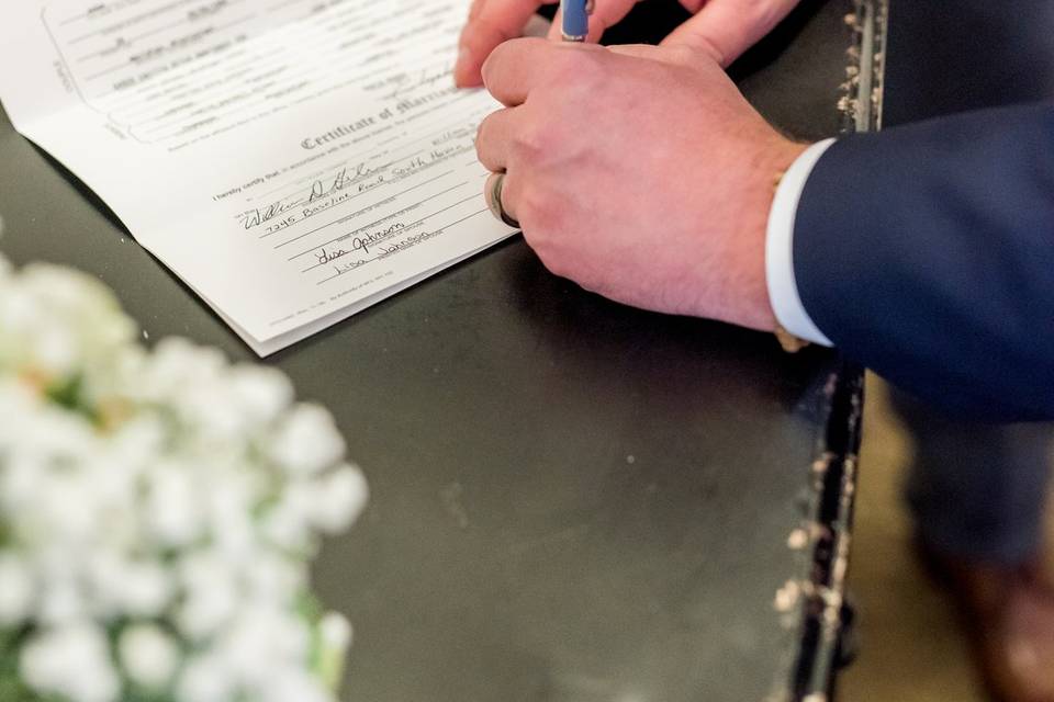 Signing the papers