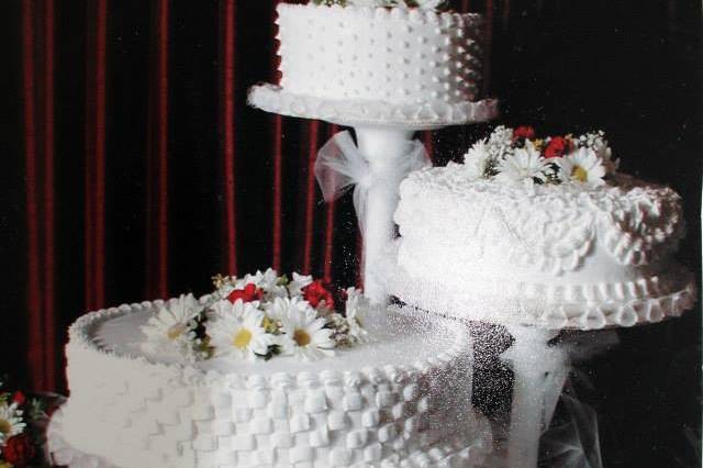 Three separate textured white cakes