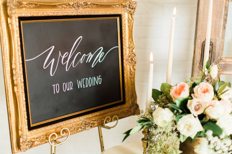 Gold frames and chalkboards with easels.