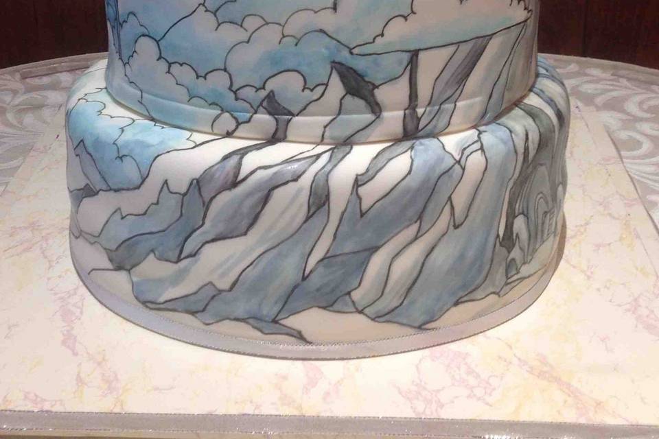 Star Wars Landscape Wedding Cake: Bottom tier is Deep Chocolate Cake, crushed peanut layer, Peanut Butter Buttercream filling. Middle and top tiers are Lemon Cake, Red Plum jelly ribbon, Raspberry Buttercream filling. Custom Star Wars Hoth and Cloud City painting by Paul (Prof) Herbert (https://www.facebook.com/Paul-Prof-Herbert-113916346379/).