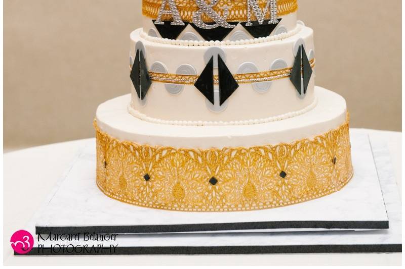 Roaring 20s Speakeasy Cake: Gluten Free Golden Ale Cake, toasted mini marshmallow layer, Midnight Ganache filling, Irish Cream Buttercream frosting. Edible gold and fondant accents. (Photography by Margaret Belenger Photography, http://www.megbelangerphotography.com.) Serves 134.