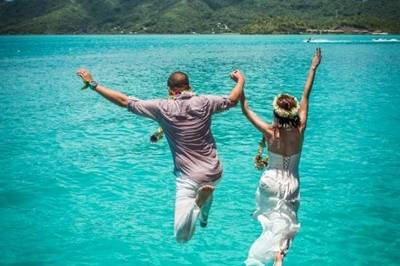 Newlyweds cliff jumping