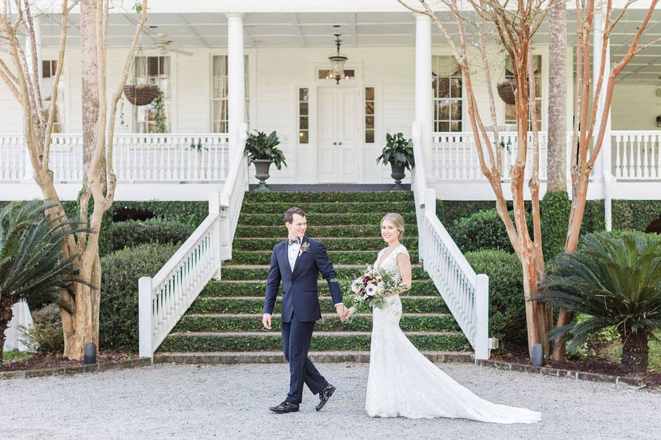 Couple in front of stairs