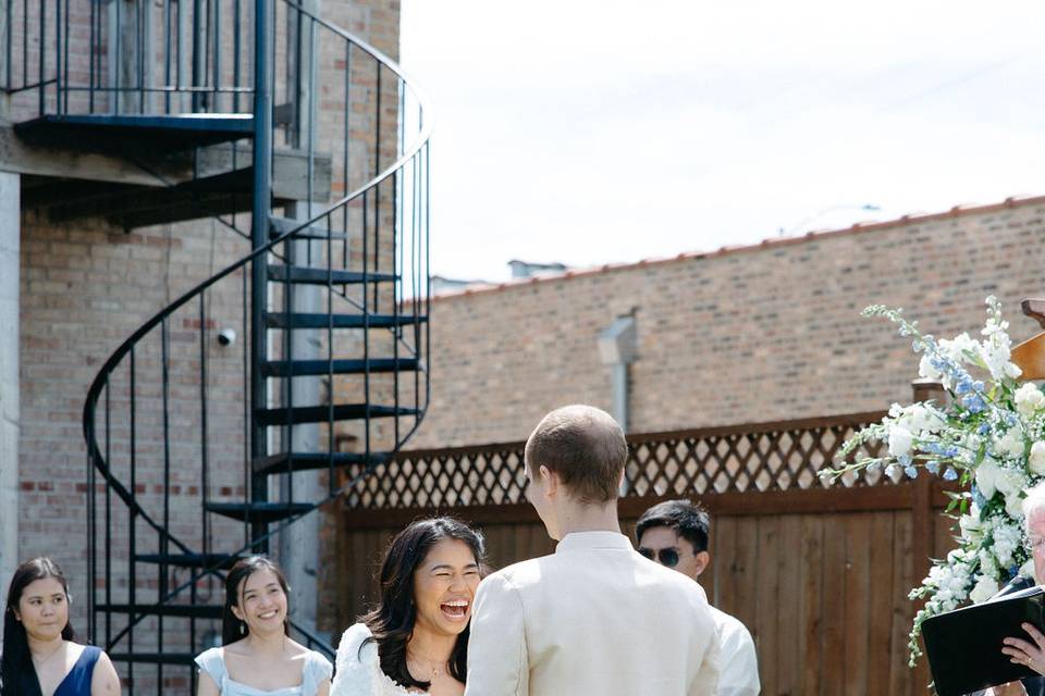 Bride and bridesmaids laughing