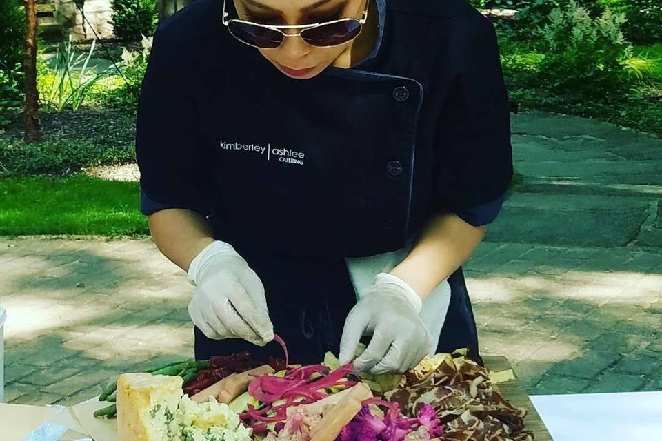 Kimberley Ashlee, putting the finishing touches on a charcuterie platter.