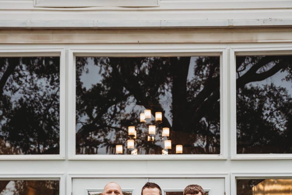 Groom and groomsmen and dogs