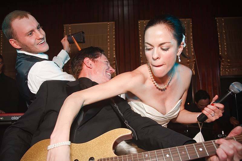 Bride strums the guitar