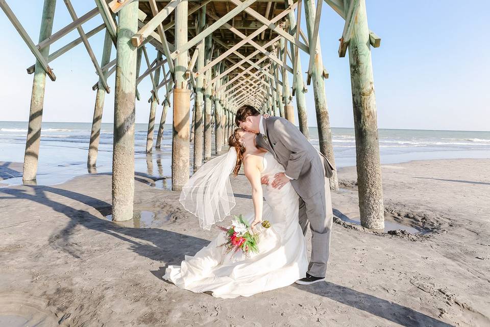 Bride and Groom under pier