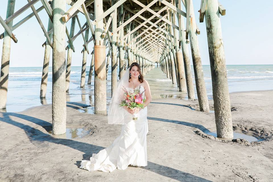 Bridal portrait under pier