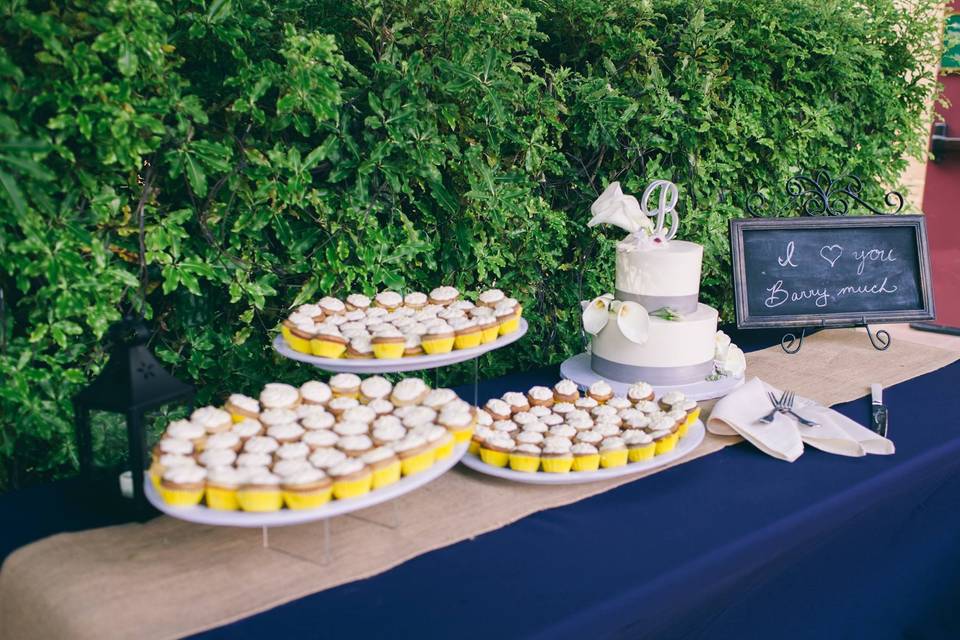 Buttercream simply elegant wedding cake w/vanilla cupcakes.