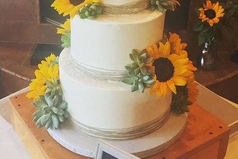 Wedding cake with sunflower edible accents