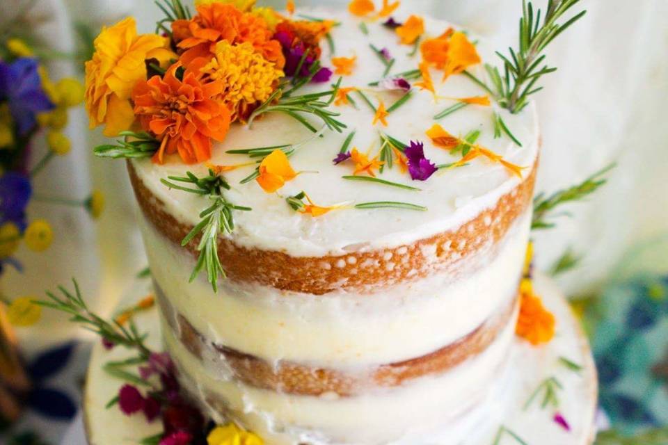 Naked butter cake with fresh flowers.