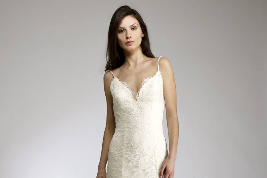 BrielleFluted backless gown of lace & silk charmeuse with beaded hemline.