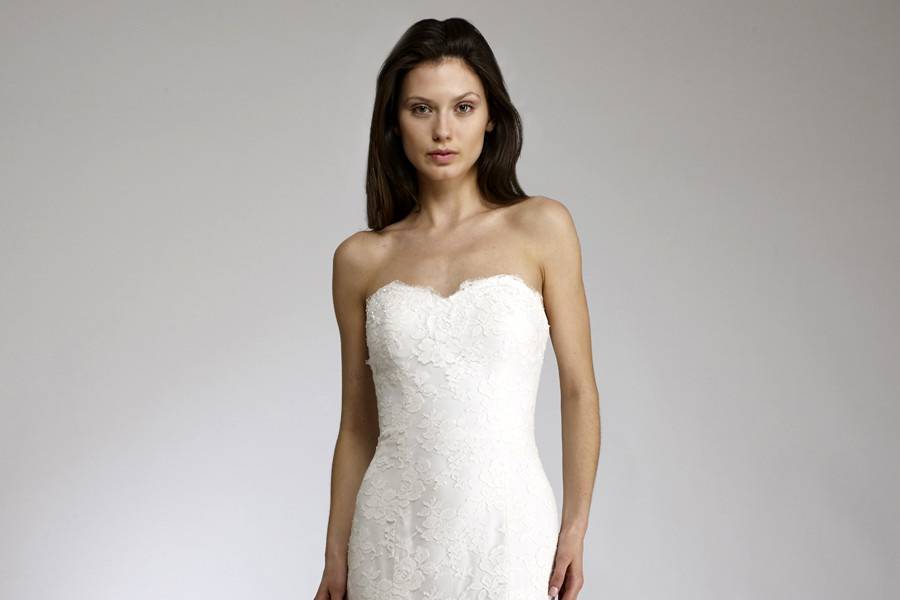 FrenchyDiamond white strapless slim fit to flare gown with sweetheart dip neckline made of one of the finest French laces,slight beading along hem and neckline.