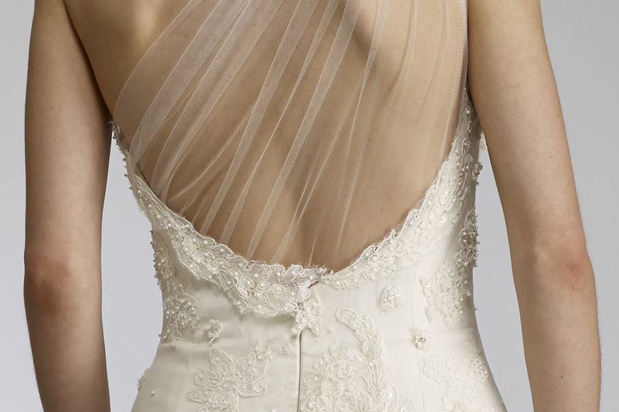 LiaOne shoulder tulle fit and flare gown with lightlybeaded French lace appliqués.