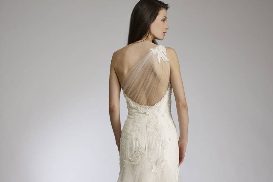 LiaOne shoulder tulle fit and flare gown with lightlybeaded French lace appliqués.