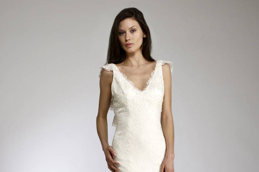 LisaSlim lace & silk charmeuse gown with ruffled “V” back and beading at neckline & hemline.