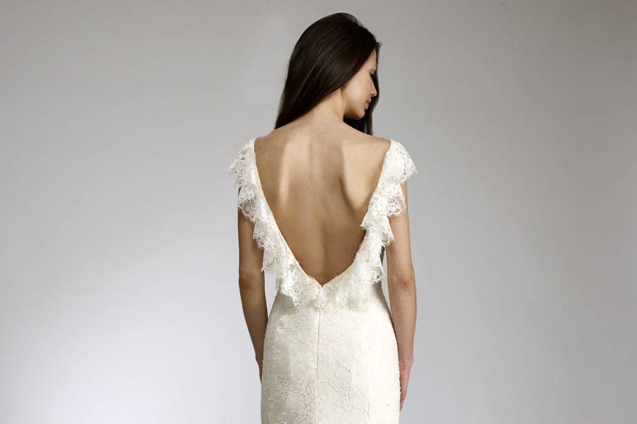LisaSlim lace & silk charmeuse gown with ruffled “V” back and beading at neckline & hemline.