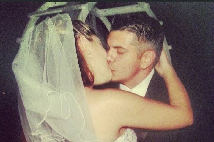 Bride and groom kissing